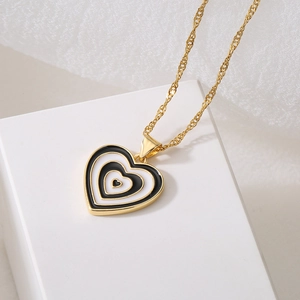 18K gold plated water wave chain necklace with black and white heart pendant