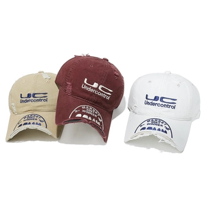 Detailed embroidery and distressed cotton texture on vintage style baseball caps