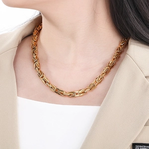 Gold Byzantine chain necklace for men in polished stainless steel on a male model