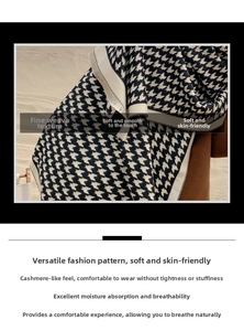 Detailed close-up of houndstooth scarf texture with soft knitted fringe edges