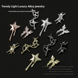 Close-up of assorted punk style nail art charms featuring alloy butterflies and stars