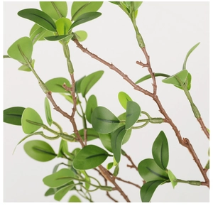 Close-up of lifelike artificial Milan leaves with detailed brown stems and green foliage