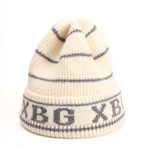 Close-up of the knitted texture and gray XBG embroidered letters on the striped beanie