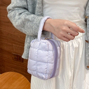 Lavender quilted cotton handbag featuring a minimalist diamond stitched pattern and soft handle
