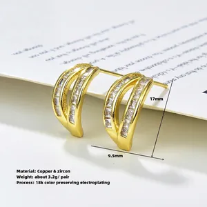 Golden 18K gold plated copper earrings with zircon inlay in a curved geometric design