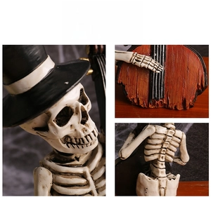 Detailed close-up of Halloween resin skull musician with hat and vintage finish