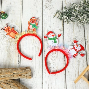 Christmas headbands featuring cartoon reindeer and snowman with festive sequin details