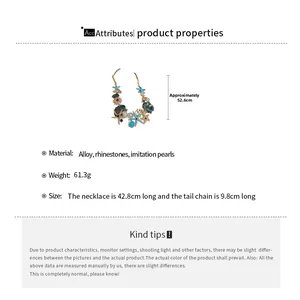 Detailed size specifications for starfish and seashell charms on gold necklace with pearls