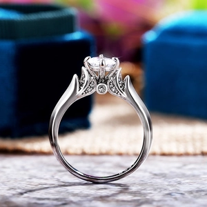 Detail of classic four-prong silver ring featuring a round AAA zircon and S925 engraving