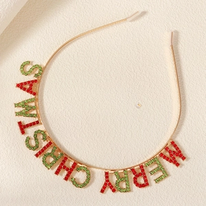 Detail of gold headband with red and green rhinestone Merry Christmas letters