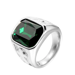 Macro view of vintage stainless steel ring featuring a large green square gemstone inlay