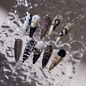Gothic stiletto press-on nails with snake pattern, checkerboard, and 3D zircon rhinestones