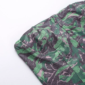 Detailed view of camouflage leaf print and double-needle stitching on slim tube top
