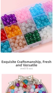 Macro view of colorful round glass jelly beads in a storage box and silver tray