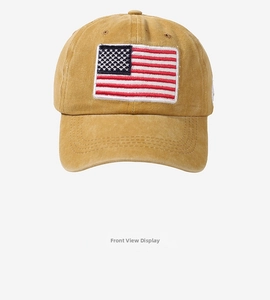 Front view of ginger cotton baseball cap with embroidered American flag patch detail