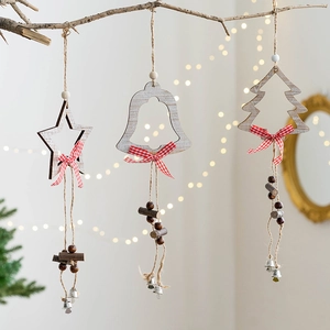 Nordic white wooden Christmas ornaments set with star, bell and tree shapes on branches