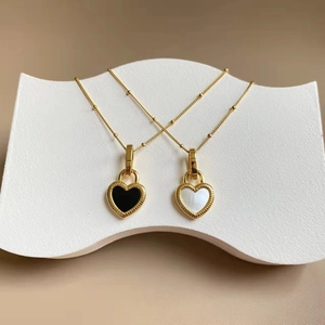 Titanium steel heart pendant necklace with black and white shells on gold bead chain