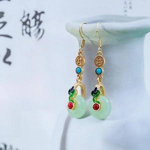 Detailed close-up of Neo-Chinese style long earrings with jade-like pendant and tassels