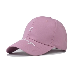 Detail of pink cotton baseball cap featuring 3D white Chicago embroidery and C patch