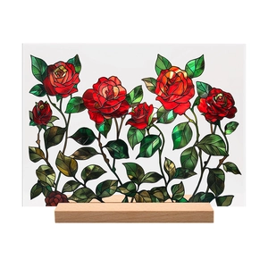 Close-up of red rose acrylic plaque with stained glass pattern on a wooden base