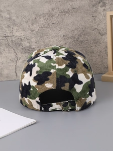 Detail view of the camouflage corduroy baseball cap showing the adjustable metal buckle strap
