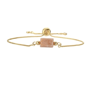 Detail view of golden box chain bracelet with pink natural stone and adjustable slider