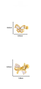 Detail view of gold butterfly and bow cartilage studs with zircon and size dimensions