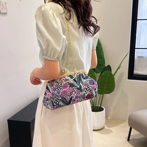 Elegant Chinese style floral embroidery handbag with gold chain strap and metal frame clasp