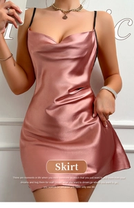 Detail of a pink silk satin slip dress featuring a cowl neck and slender straps