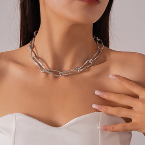 Textured silver chunky chain necklace with liquid metal ripple design worn by a model