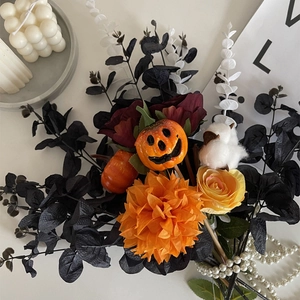 Halloween bouquet with black eucalyptus, orange pumpkin, dahlia and yellow roses