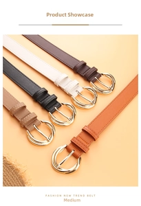 Five assorted colors of women fashion belts with gold round buckles on orange background