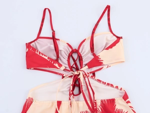 Detail view of red coconut tree print dress with lace-up back and adjustable straps