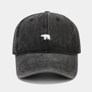 Vintage washed cotton baseball cap in charcoal black with a small white bear embroidery