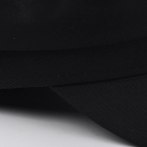 Detailed close-up showing precise stitching and woven fabric texture of the black military cap