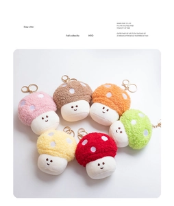 Group of six colorful plush mushroom keychains with gold clasps on white background