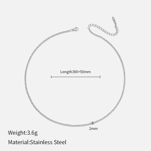 Macro detail of 2mm silver stainless steel Cuban chain necklace with measurement specs