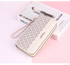 Double zipper long wallet with wrist strap and monogram pattern on cream PU leather