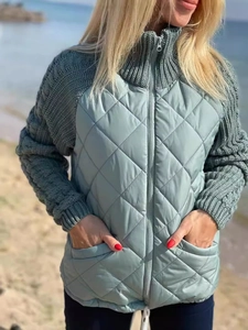 Women's green quilted zip-up jacket with knit sleeves and stand collar for autumn