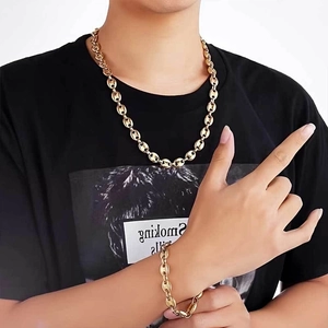 Close-up of gold plated 8mm coffee bean chain necklace and bracelet on model