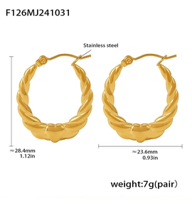 Detail view of heart-shaped gold twist earrings with dimensions 28.4mm x 23.6mm