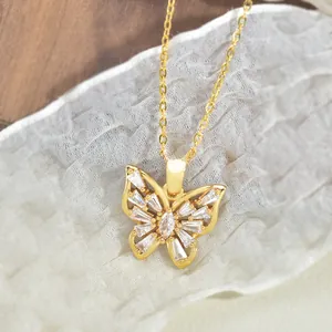 Close-up of butterfly pendant necklace with inlaid zircon and gold-plated chain details