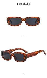 Close-up of demi-black rectangular sunglasses with wide temples and dark lenses