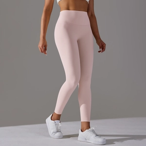 Detail shot of the high-waisted seamless waistband on light pink yoga leggings
