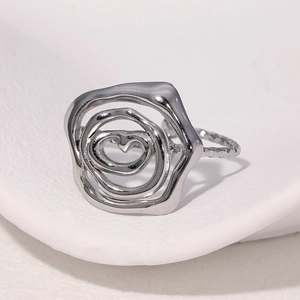 Irregular silver rose swirl open ring in 18k plated stainless steel on white background