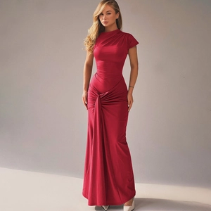 Detail view of red slim fit maxi dress featuring side pleats and elegant draped waist design