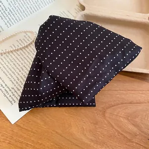 Polka dot fabric triangle hair claw clip for women in a retro aesthetic style