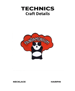 Detailed macro view of panda enamel pin showing Pandamonium lettering and smooth finish
