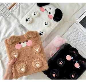 Detail of plush animal binders featuring bear, dog and cat designs with 3D paw prints
