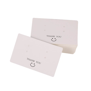 White cardboard jewelry display cards with Thank You text and smiley face icons